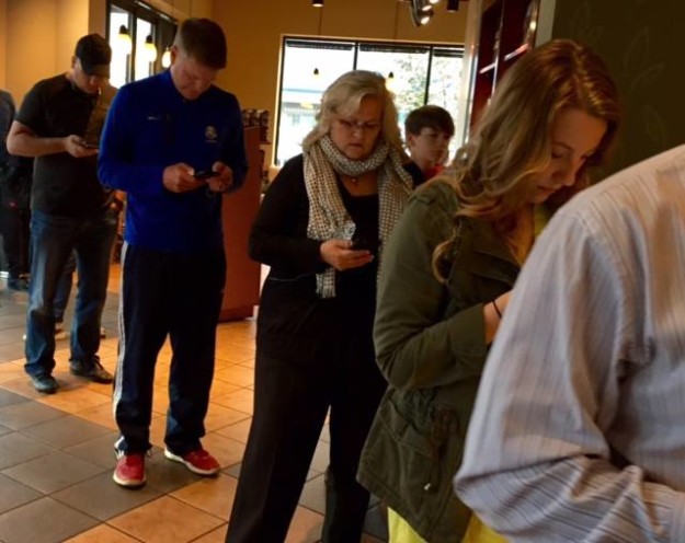 standing-in-line-on-phones
